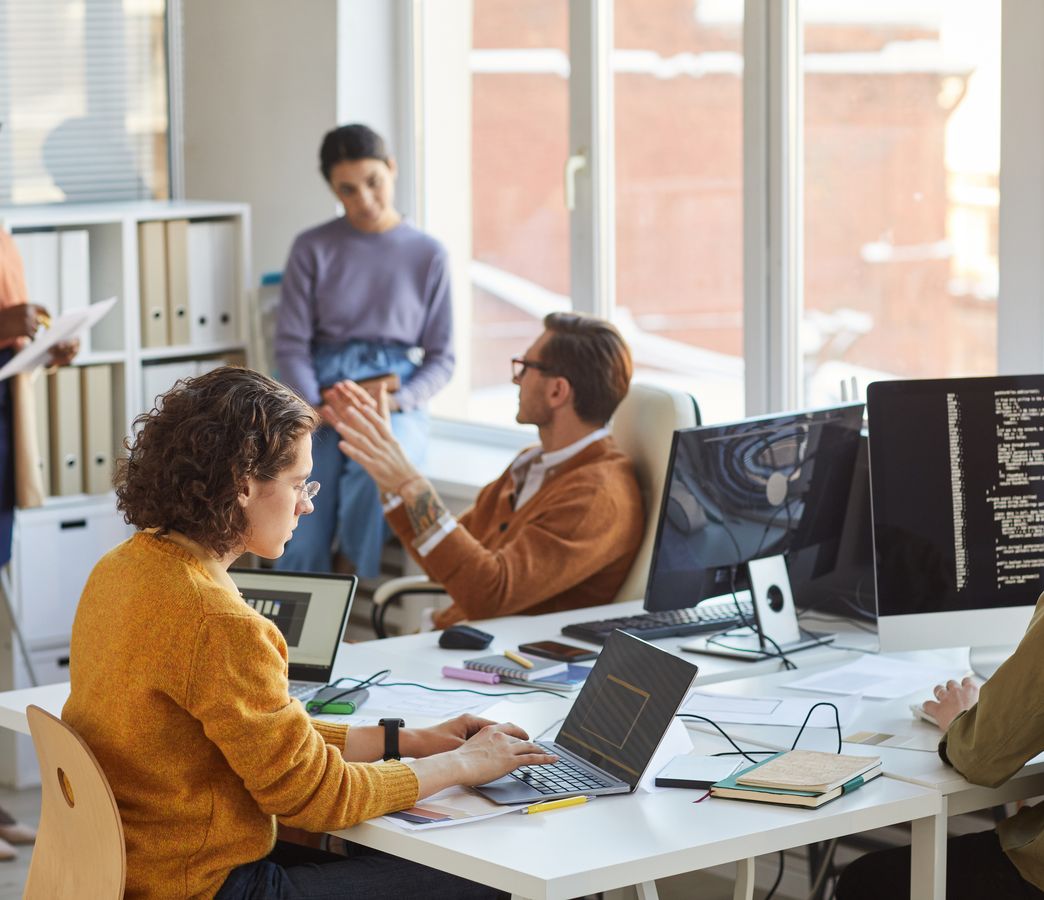 a software development team working at a table